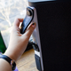 The handle is hidden on the back. Beneath it, you can see the cover for the input ports.